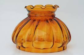 Amber glass decorative vase with ribbed sides and an open top