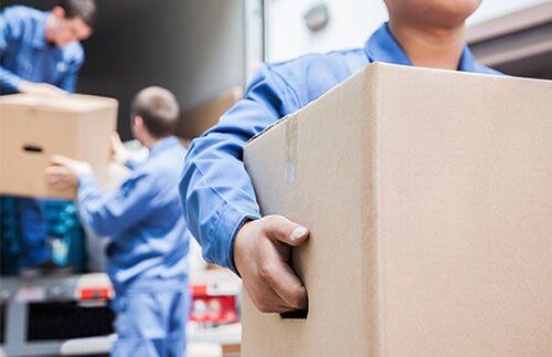 Employees Lifting Boxes - Moving & Storage Company in Ceaufort, SC