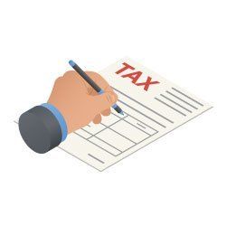 A hand is writing on a tax form with a pen.