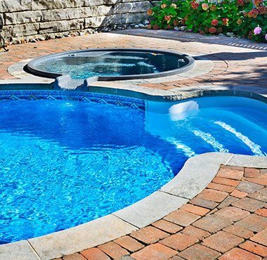 Swimming Pool with Hot Tub — Flowery Branch, GA — Living Waters Pools & Hardscapes Swimming Pool with Hot Tub — Flowery Branch, GA — Living Waters Pools & Hardscapes
