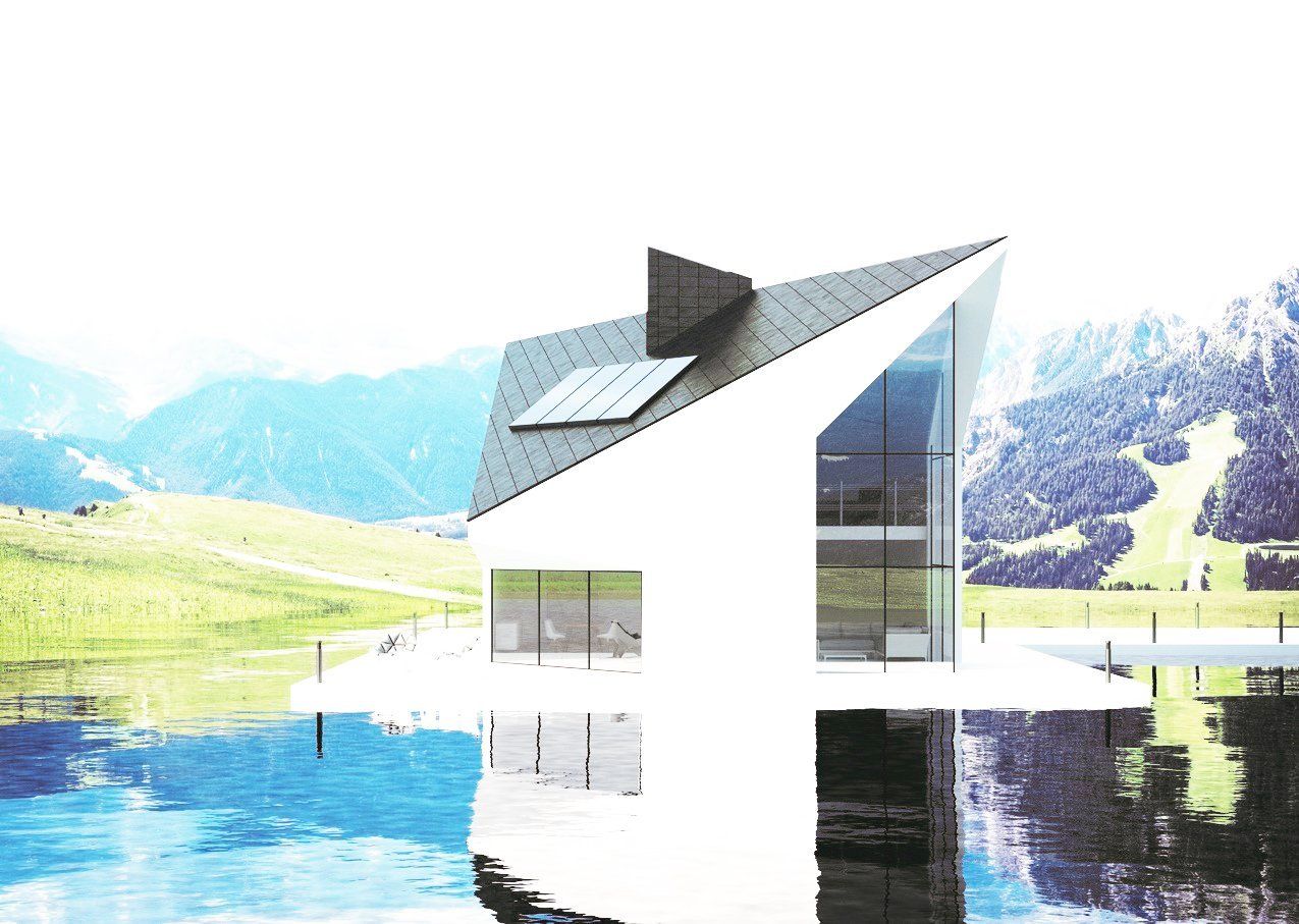 Ein weißes Haus liegt auf einem See mit Bergen im Hintergrund