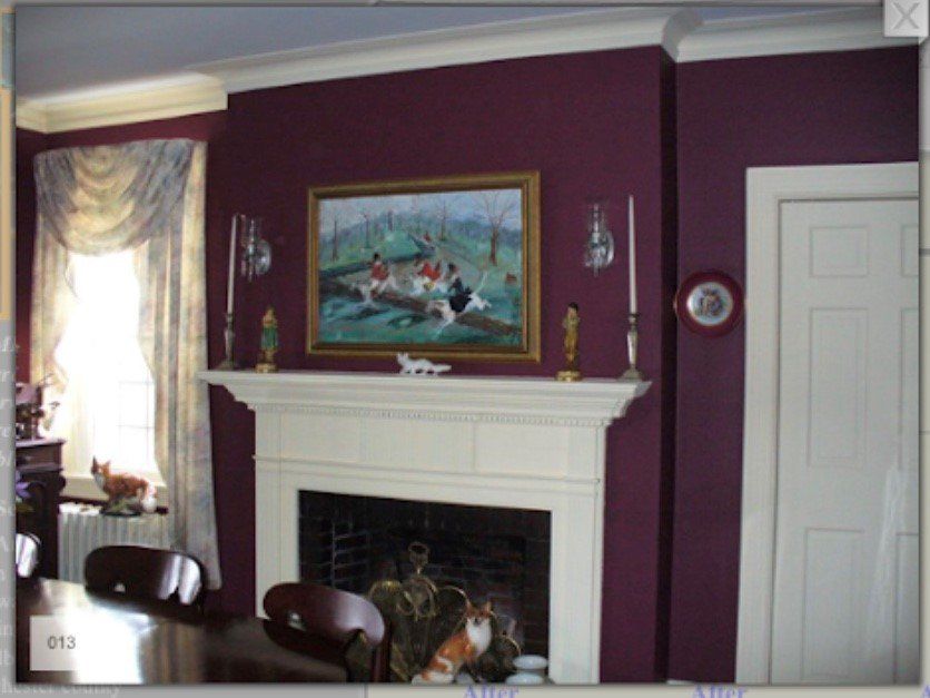Purple living room with white fireplace, nautical painting, and window with curtains