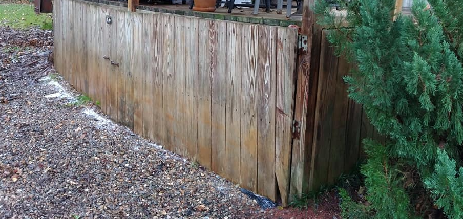 Pressure washing siding of house
