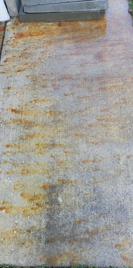 Pressure washing siding of house