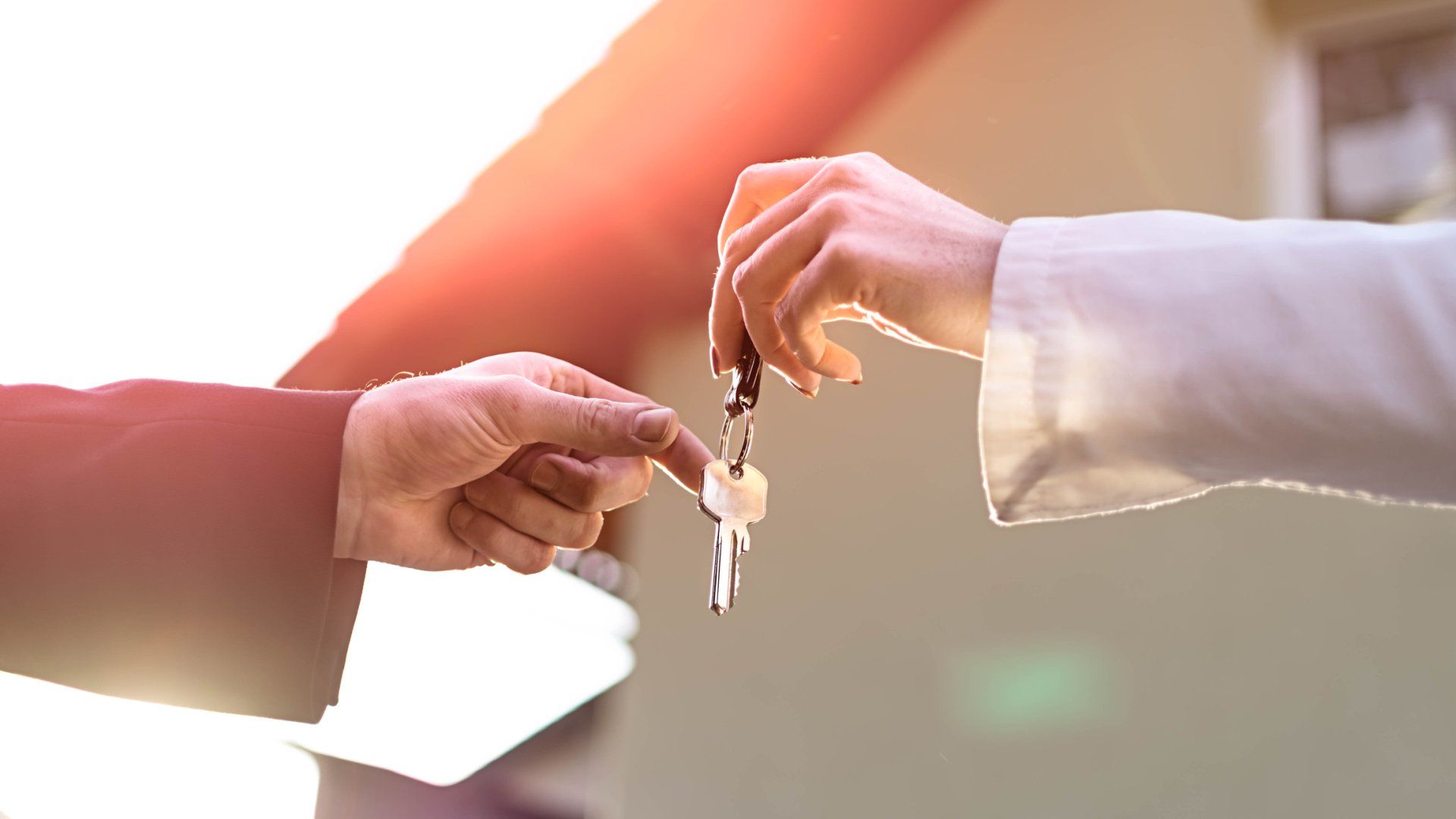 Real estate agent congratulates the new buyer to buy a house