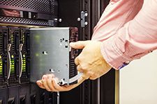 man servicing a server