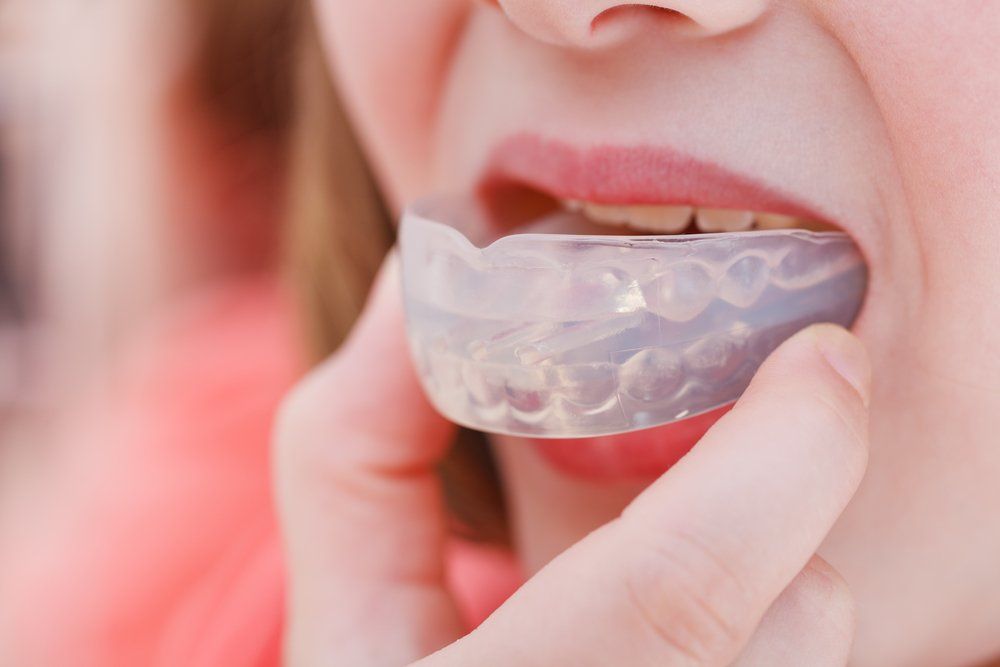 Wearing Mouthguard — Ballina Denture Clinic Michael J Parker in Ballina, NSW