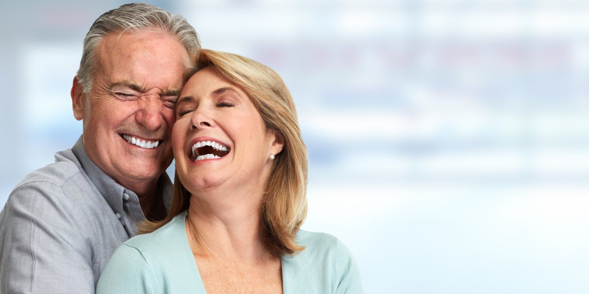 Smiling Elderly Couple with Dentures — Ballina Denture Clinic Michael J Parker in Ballina, NSW