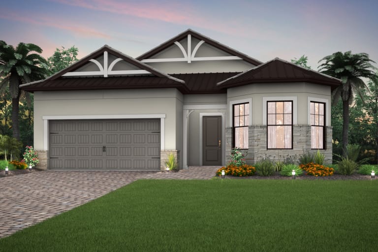A house with a garage and a lot of windows is sitting on top of a lush green lawn.