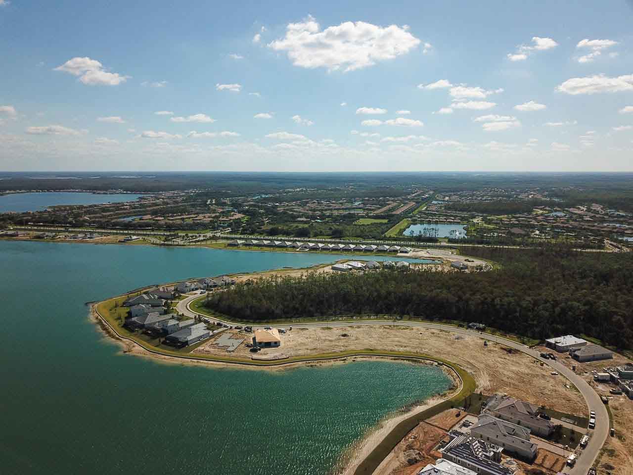 An aerial view of a large body of water with a small island in the middle.