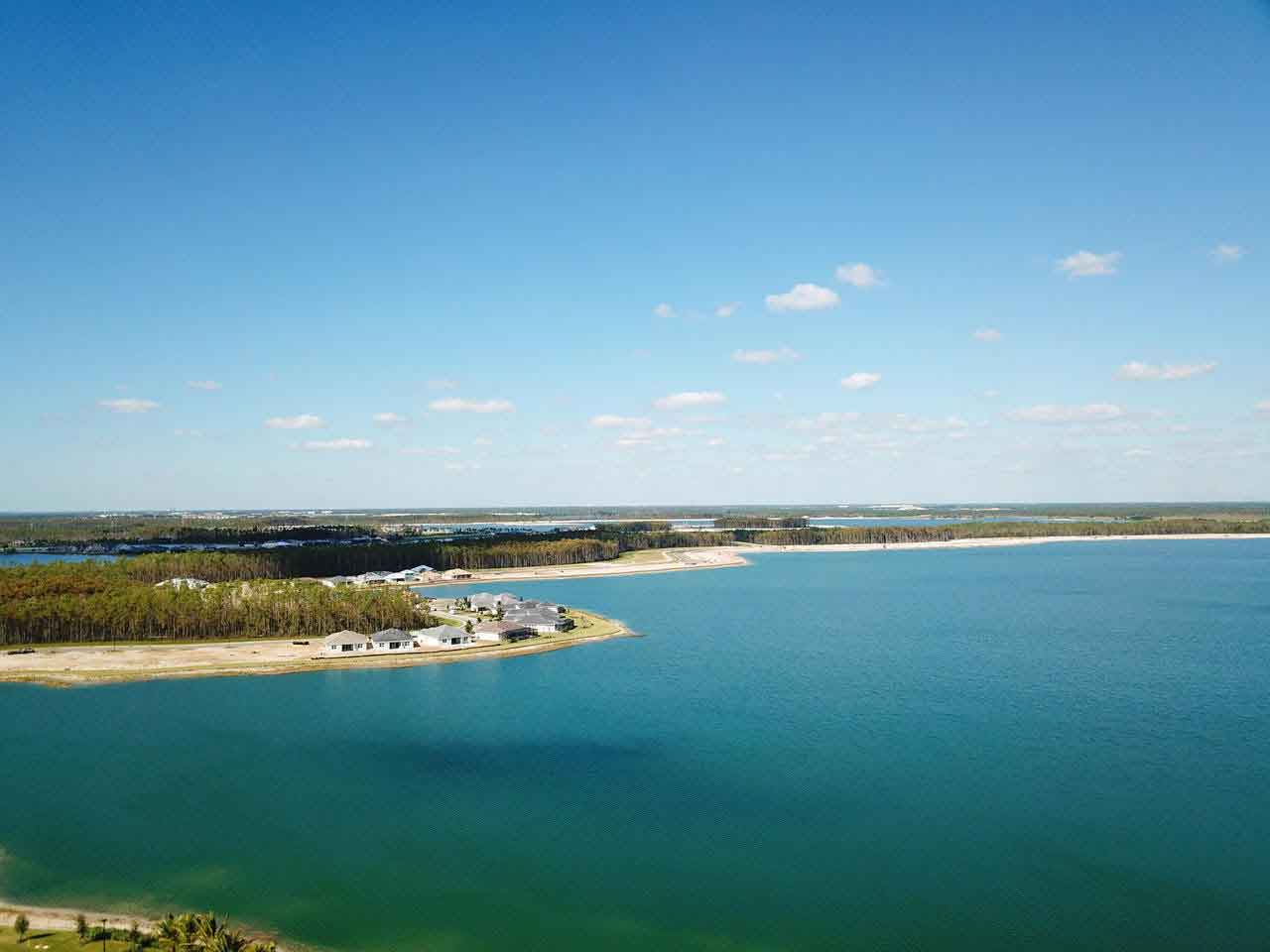 An aerial view of a large body of water with a small island in the middle.