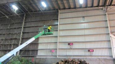 Inside of warehouse being painted white.