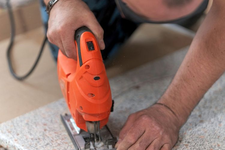 Woodworker Using a Jigsaw — Toledo, OH —West Equipment Co. Inc. Woodworker Using a Jigsaw — Toledo, OH —West Equipment Co. Inc.