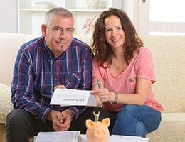 Couple Signing Life Insurance Contract — Insurance in Port Orange, FL Couple Signing Life Insurance Contract — Insurance in Port Orange, FL