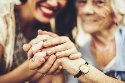 Mother and Daughter Holding Hands — Insurance in Port Orange, FL Mother and Daughter Holding Hands — Insurance in Port Orange, FL