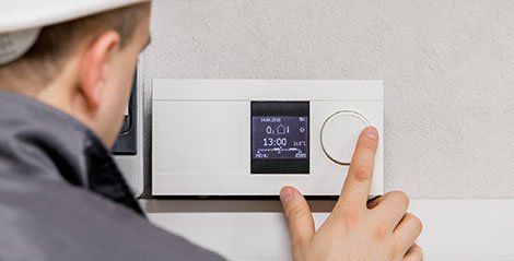 Adjusting thermosta - HVAC and Plumbing Contractor in North Troy, NY Adjusting thermosta - HVAC and Plumbing Contractor in North Troy, NY