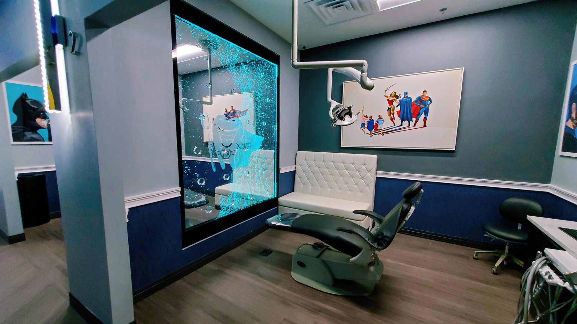 A dental office with a dental chair and a bubble wall.