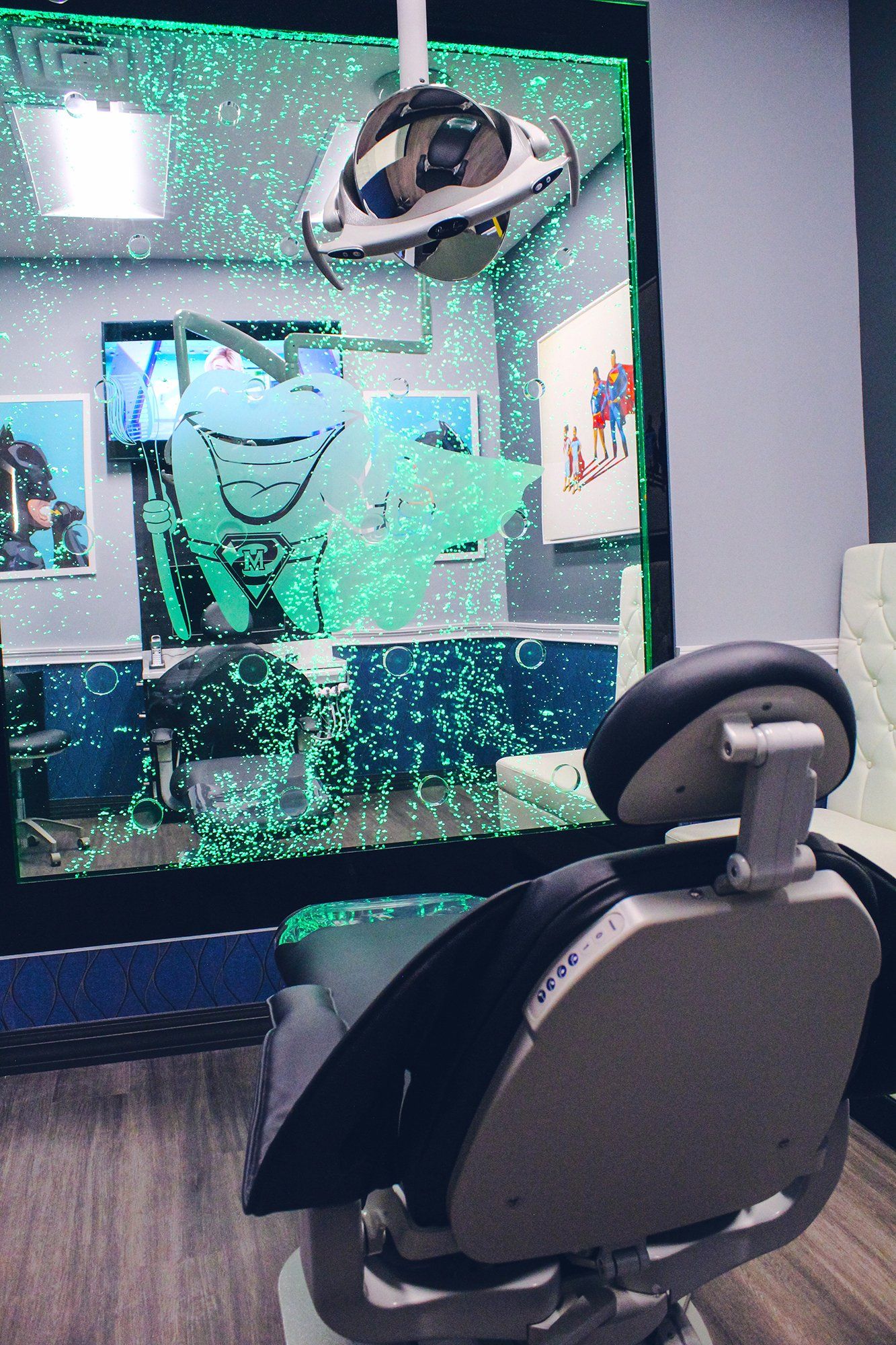 Mighty Smiles Dental, Dallas & Fort Worth. A dental chair in front of a bubble wall in a dental office.
