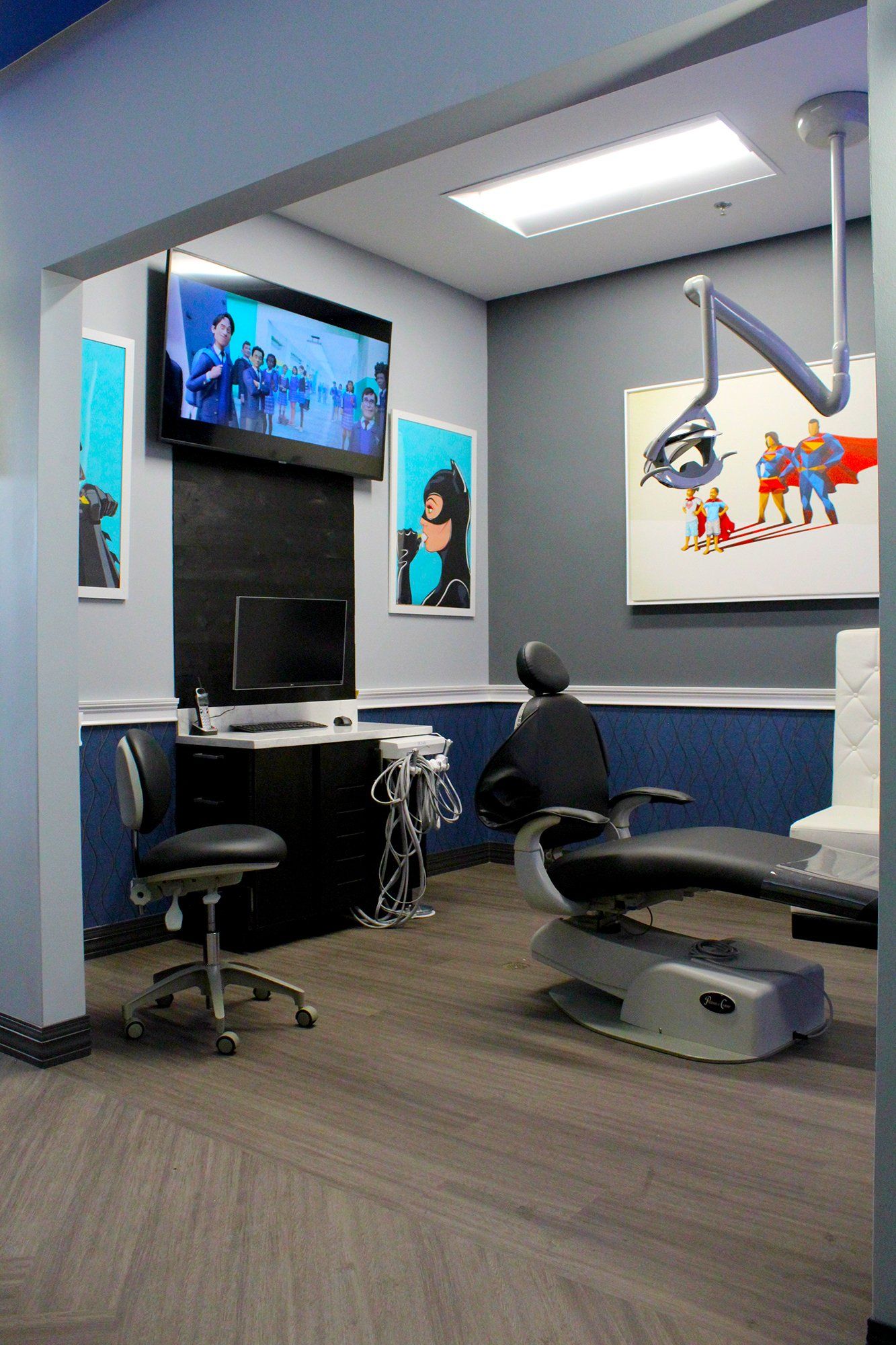 Mighty Smiles Dental, Dallas & Fort Worth. A dental office with a dental chair and a television on the wall.