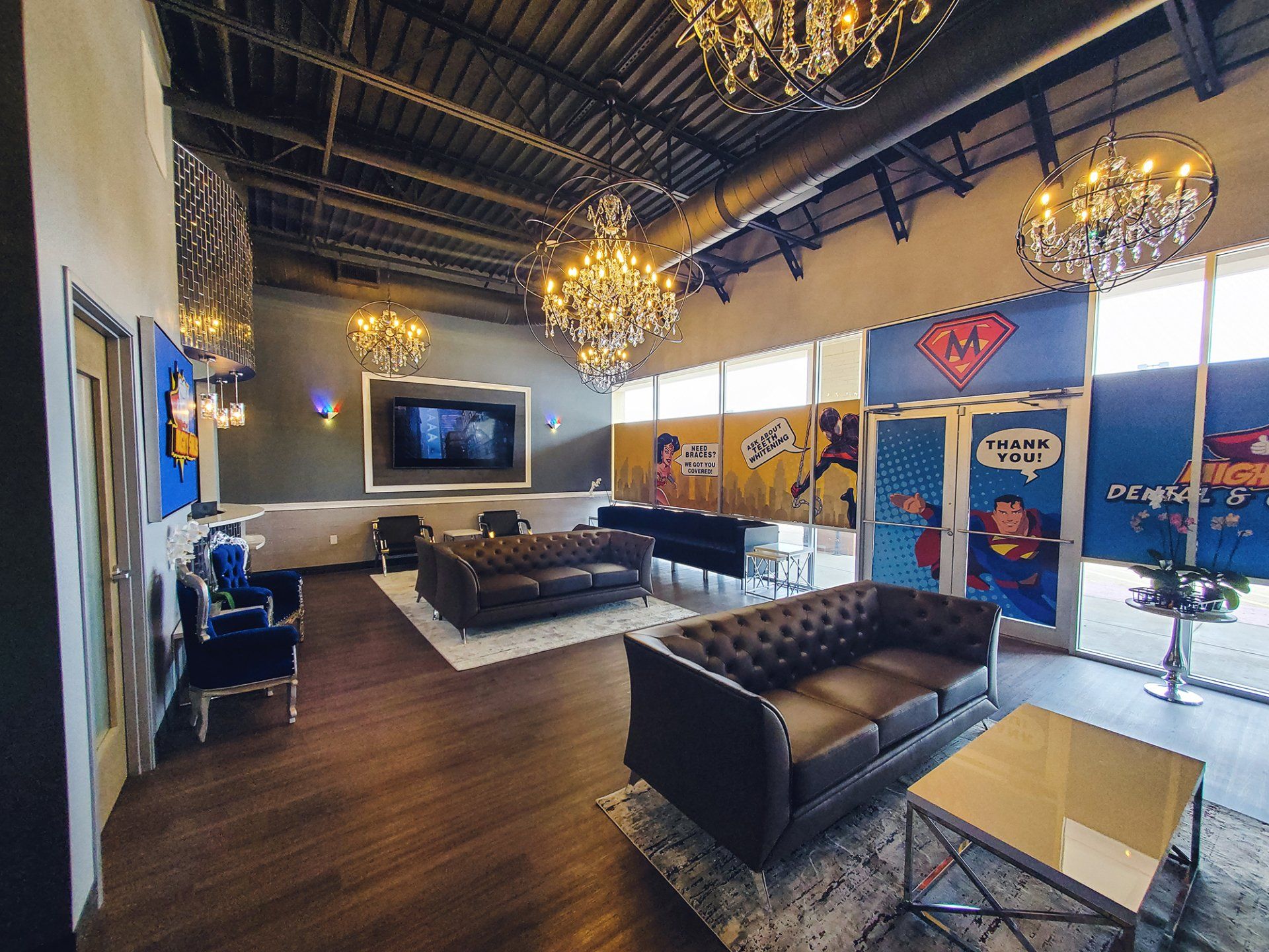 Mighty Smiles Dental, Dallas & Fort Worth. room with a couch , table , chairs and a television.