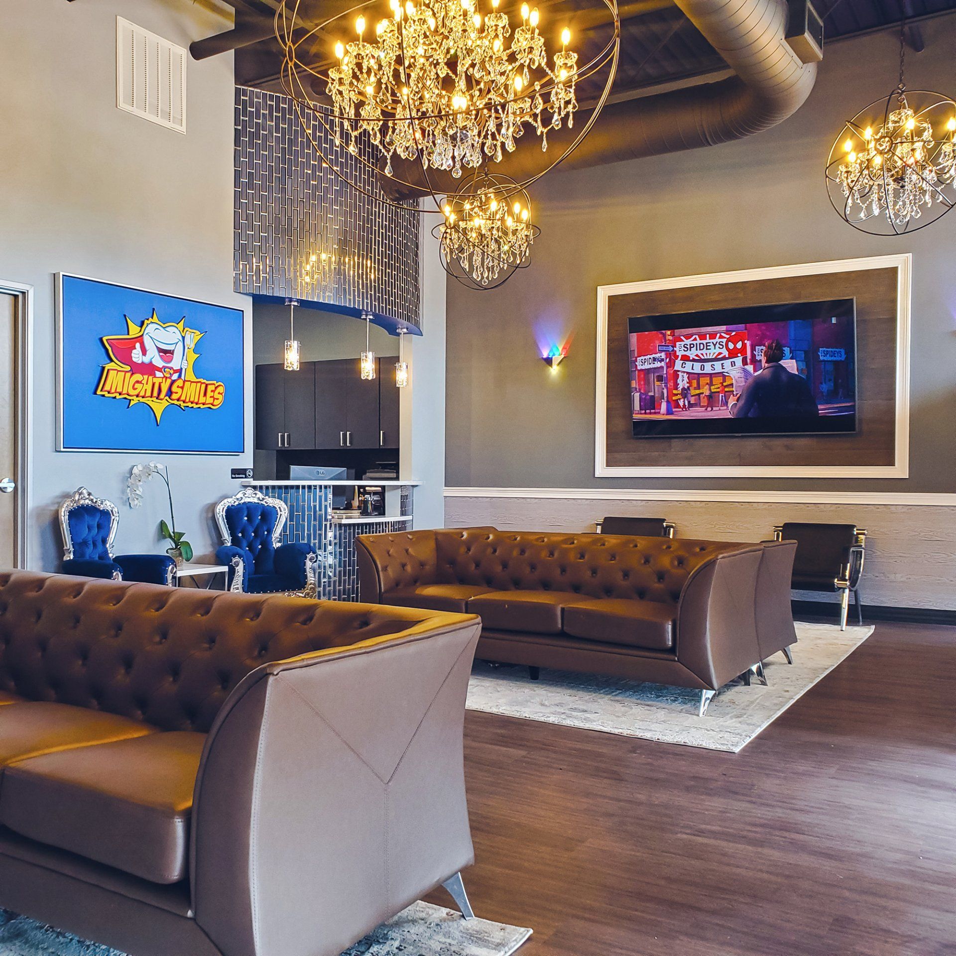 Mighty Smiles Dental, Dallas & Fort Worth. Lobby A living room with a couch and a tv on the wall
