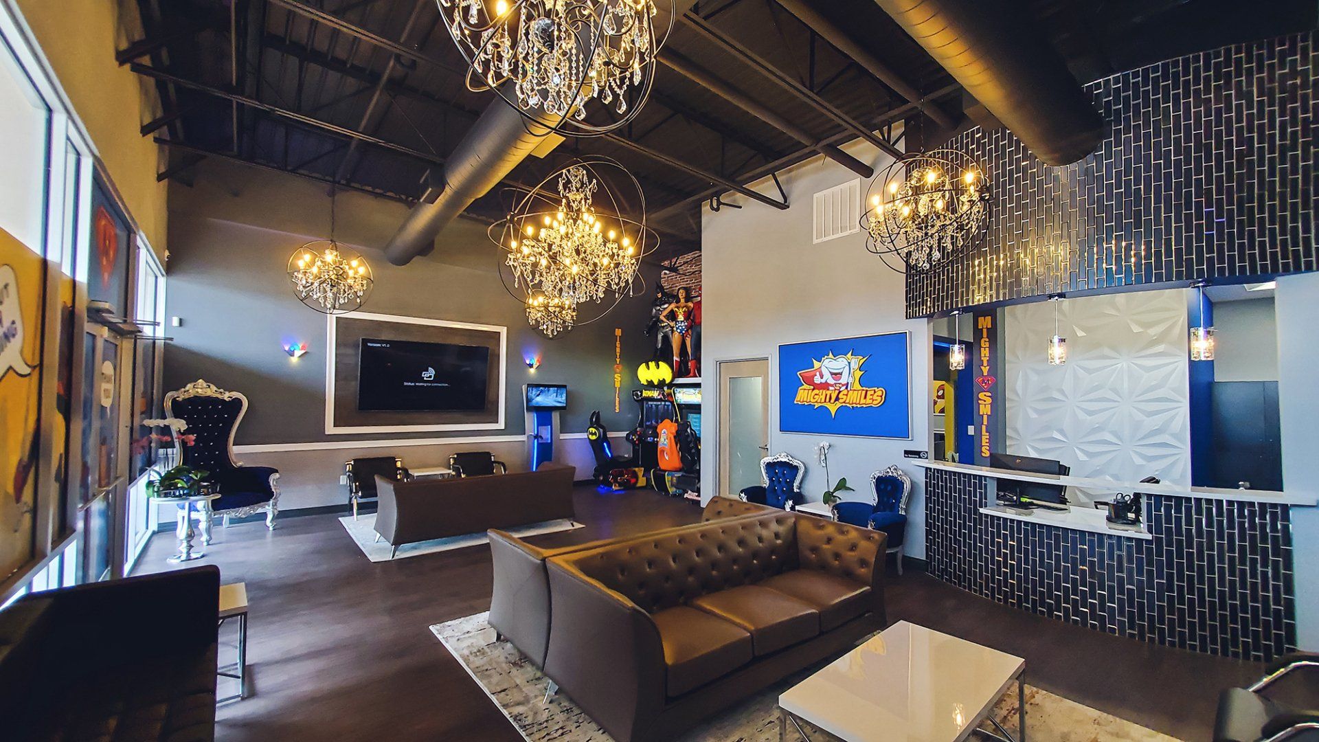 Mighty Smiles Dental, Dallas & Fort Worth. with a couch , table , chairs and a television.