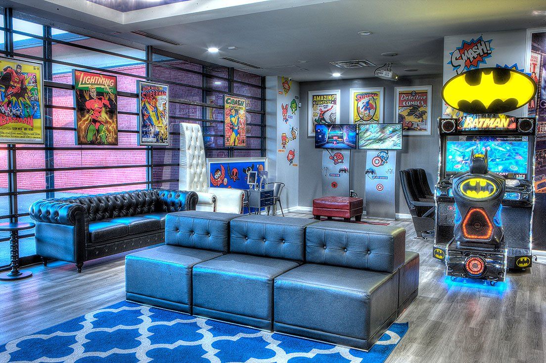 Mighty Smiles Dental, Dallas & Fort Worth. Lobby A living room filled with furniture and a batman arcade machine.