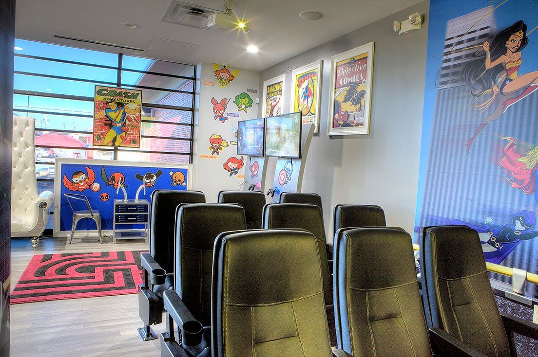 Mighty Smiles Dental, Dallas & Fort Worth. Lobby with a lot of chairs and posters on the wall.