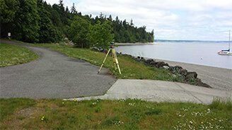 Building surveyor in hi vis carrying work folders and calculator located in Elma WA 98541 Building surveyor in hi vis carrying work folders and calculator located in Elma WA 98541