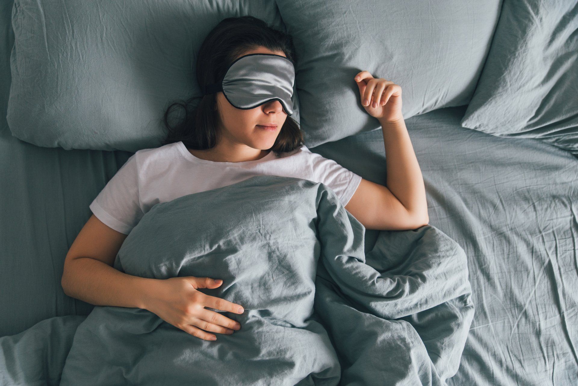 Feng Shui — Woman Sleeping on Bed in New Orleans, LA