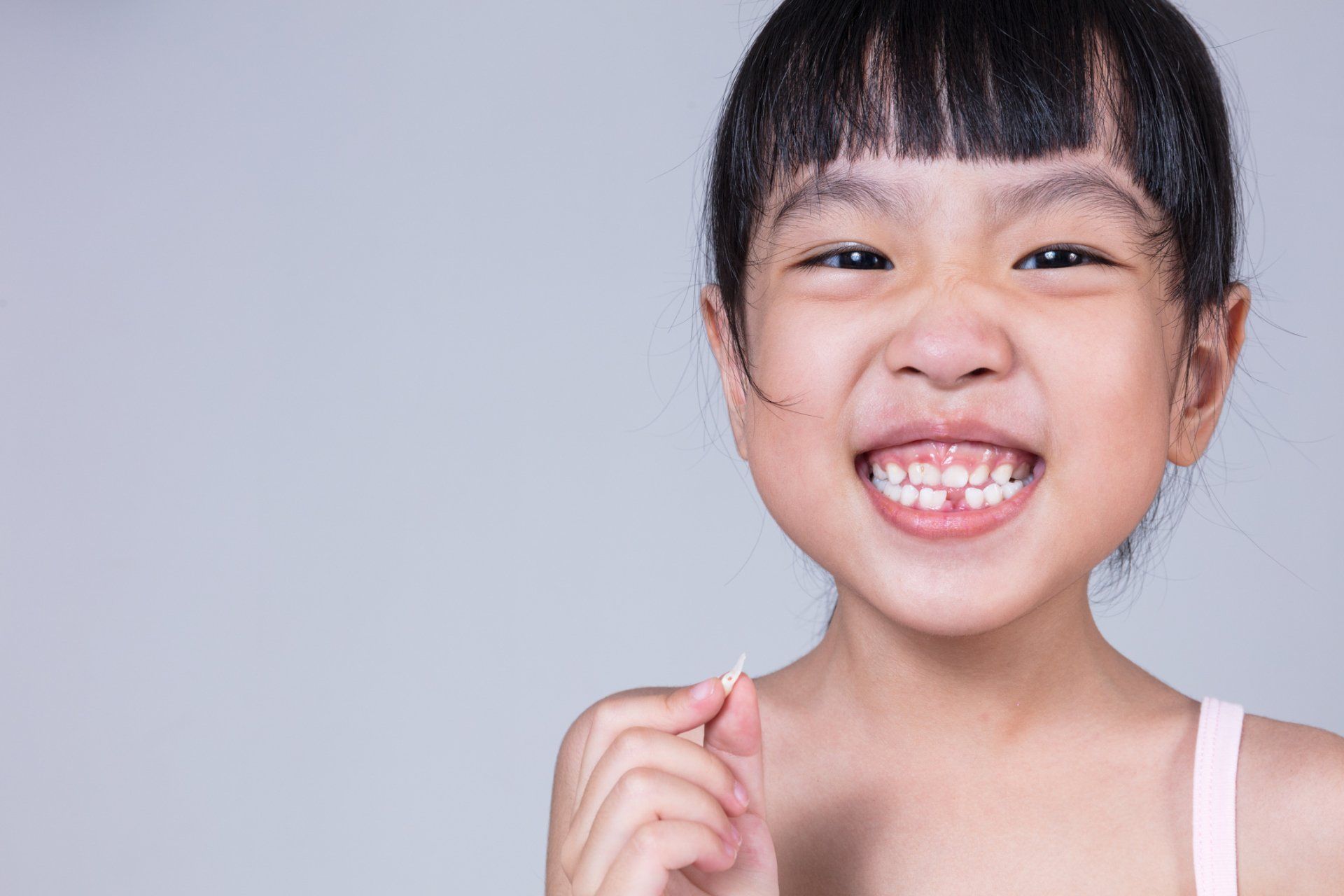 Kid Holding Her Teeth — Albuquerque, NM — Aragon Pediatric Dentistry