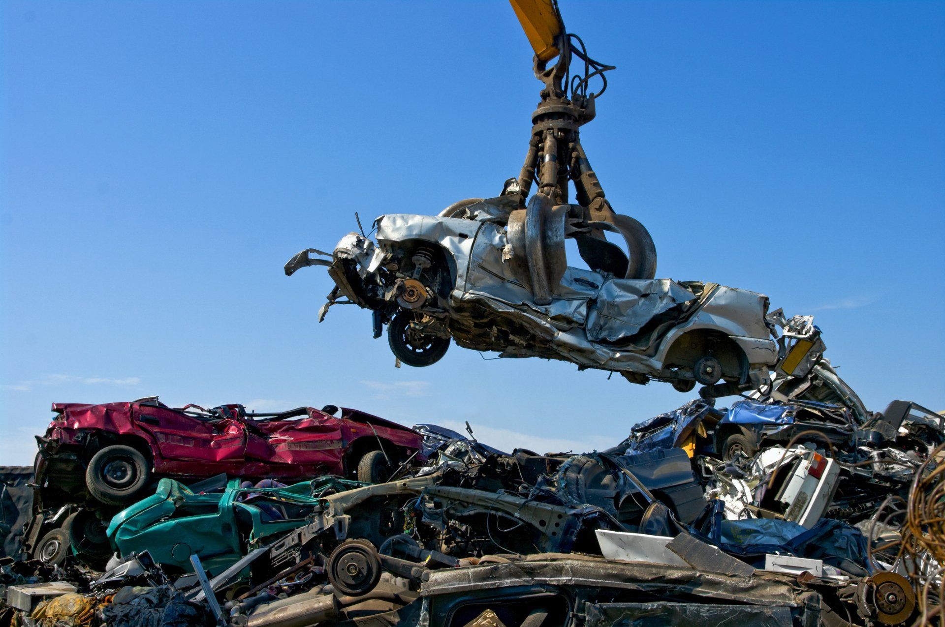 Picking Broken Car in Junkyard — St Thomas, PA — St. Thomas Towing and Auto Repair Inc. Picking Broken Car in Junkyard — St Thomas, PA — St. Thomas Towing and Auto Repair Inc.