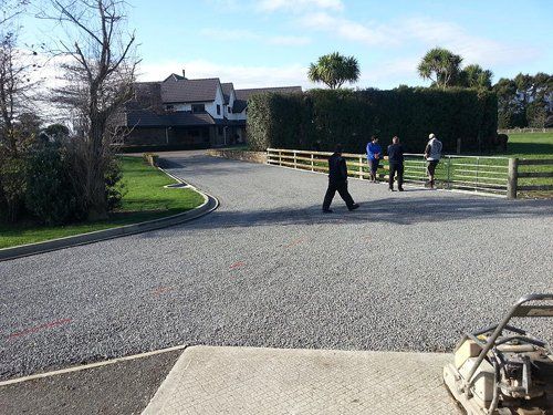 People walking on a newly surfaced road