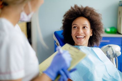 Woman having teeth examined at dentist — Wyoming, MI — Dental South Woman having teeth examined at dentist — Wyoming, MI — Dental South