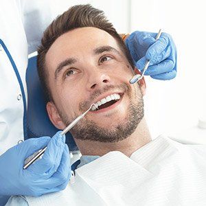 Dentist doing dental checkup — Wyoming, MI — Dental South Dentist doing dental checkup — Wyoming, MI — Dental South