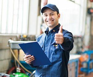 Smiling Mechanic Thumbs Up - Car Batteries in Bellflower, CA Smiling Mechanic Thumbs Up - Car Batteries in Bellflower, CA