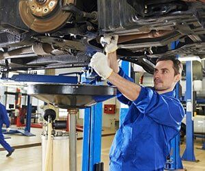 Mechanic Repairing the Suspension on a Car - Steering Components in Bellflower, CA Mechanic Repairing the Suspension on a Car - Steering Components in Bellflower, CA