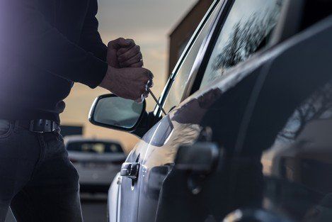 Vehicle Theft — A Guy Breaking A Side Mirror in Gardendale, AL Vehicle Theft — A Guy Breaking A Side Mirror in Gardendale, AL