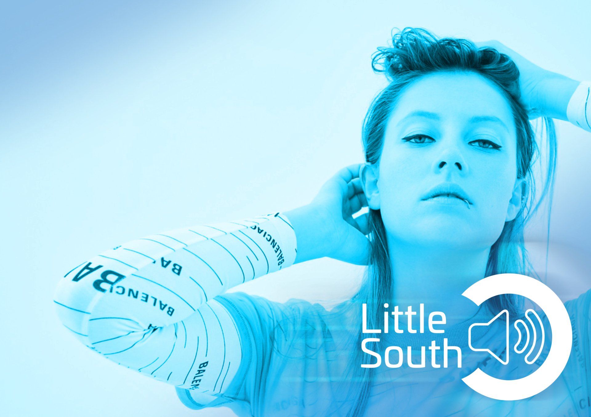A woman with a bandage on her arm and the words little south on the bottom