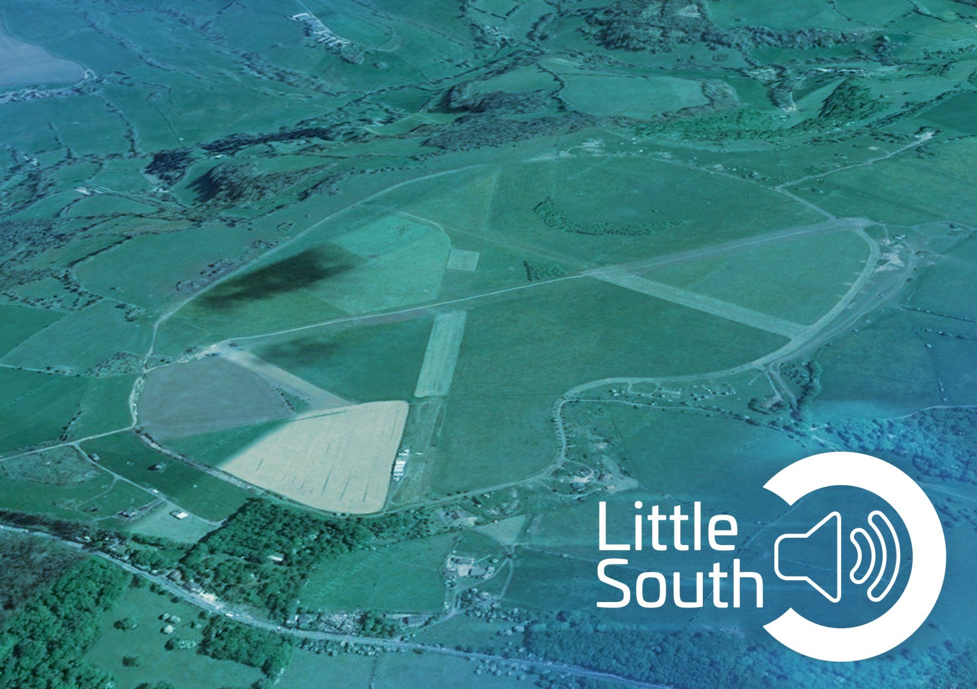 An aerial view of a field with the words little south below it