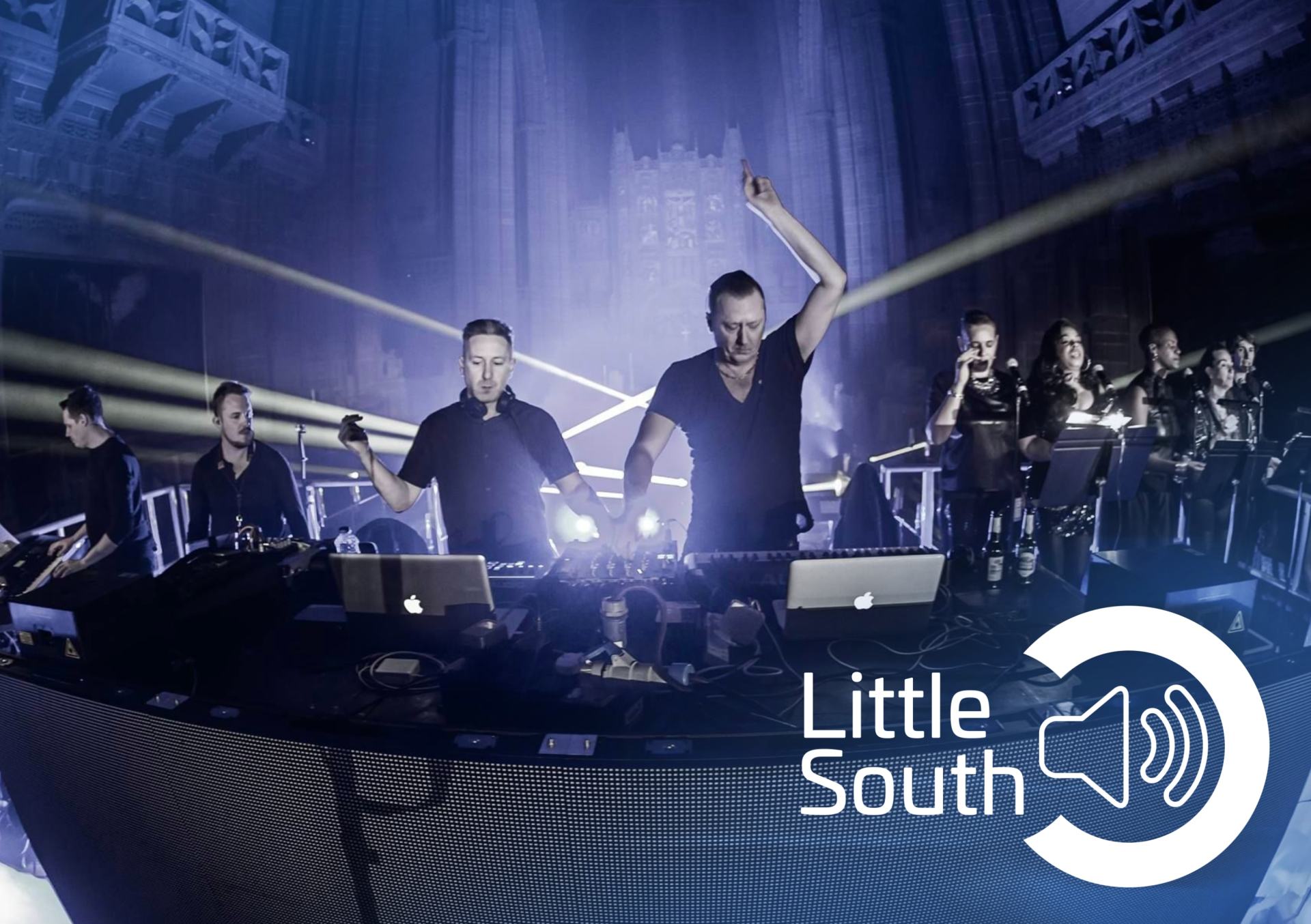A group of people on a stage with the words little south on the bottom