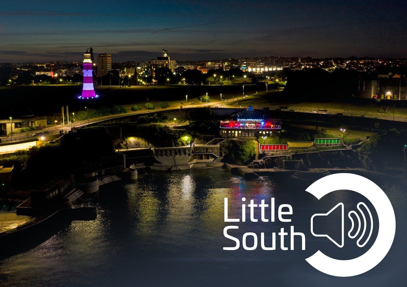 An aerial view of a city at night with the words little south on the bottom