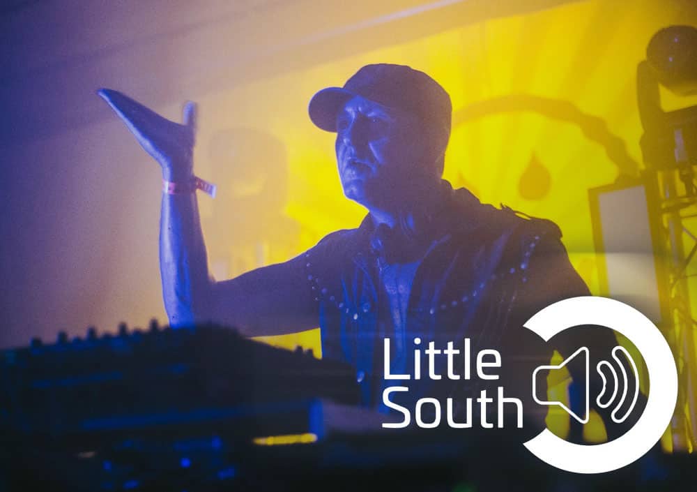 A man playing a keyboard with the words little south on the bottom