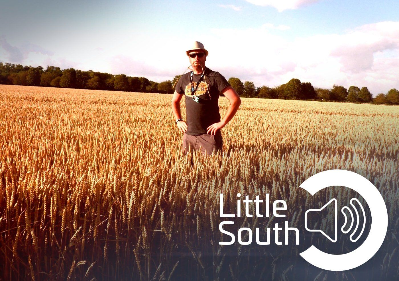 A man standing in a field with the words little south on the bottom