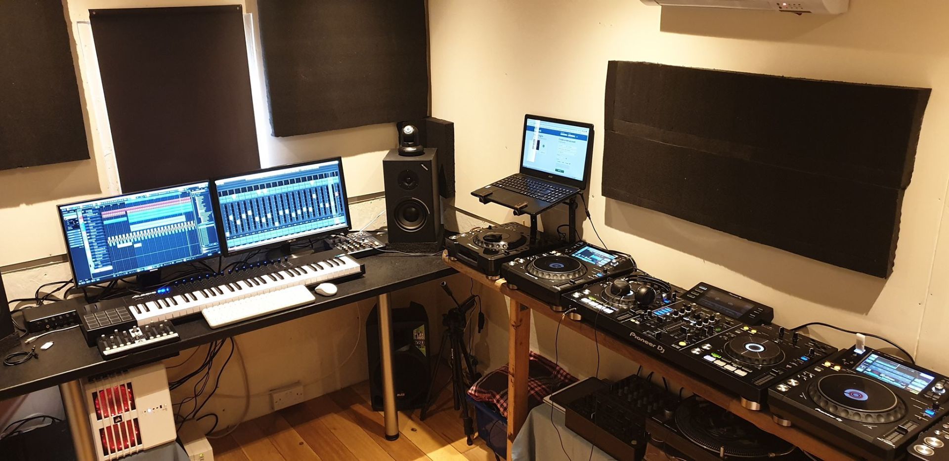 A room filled with lots of electronic equipment including a laptop