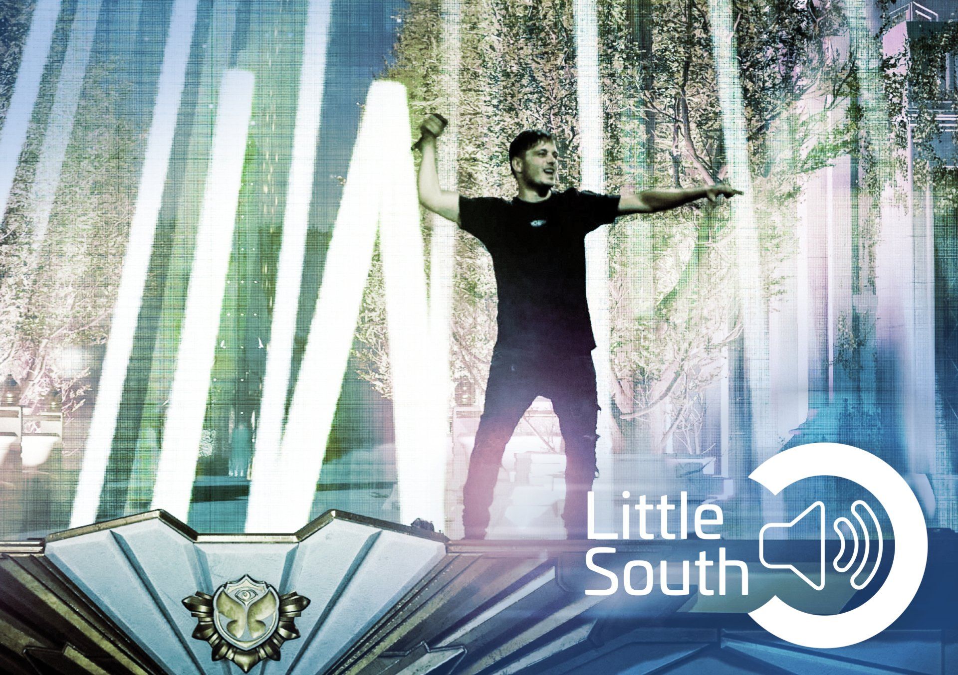 A man is standing in front of a sign that says little south