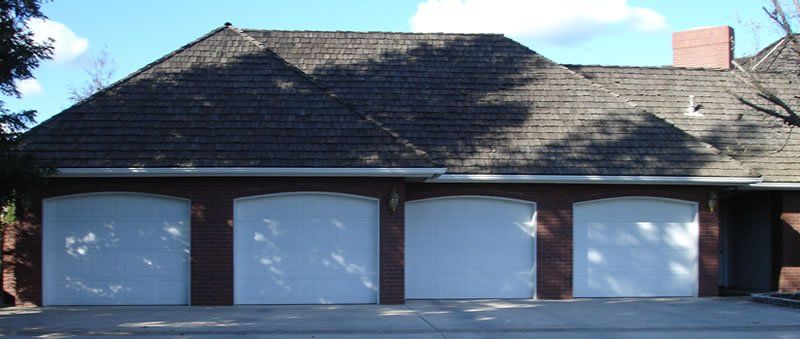 4 Door Brick Before — Diamond Springs, CA — Sierra Nevada Overhead Door