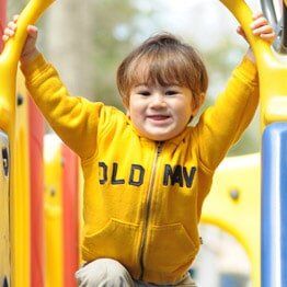 Little boy with yellow jacket - Childcare in Bayville, NJ Little boy with yellow jacket - Childcare in Bayville, NJ