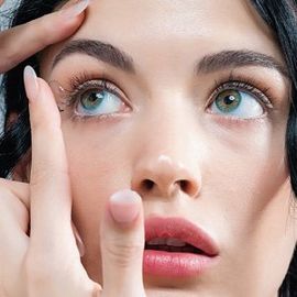 Woman Putting in Contact Lens in Sunrise, FL