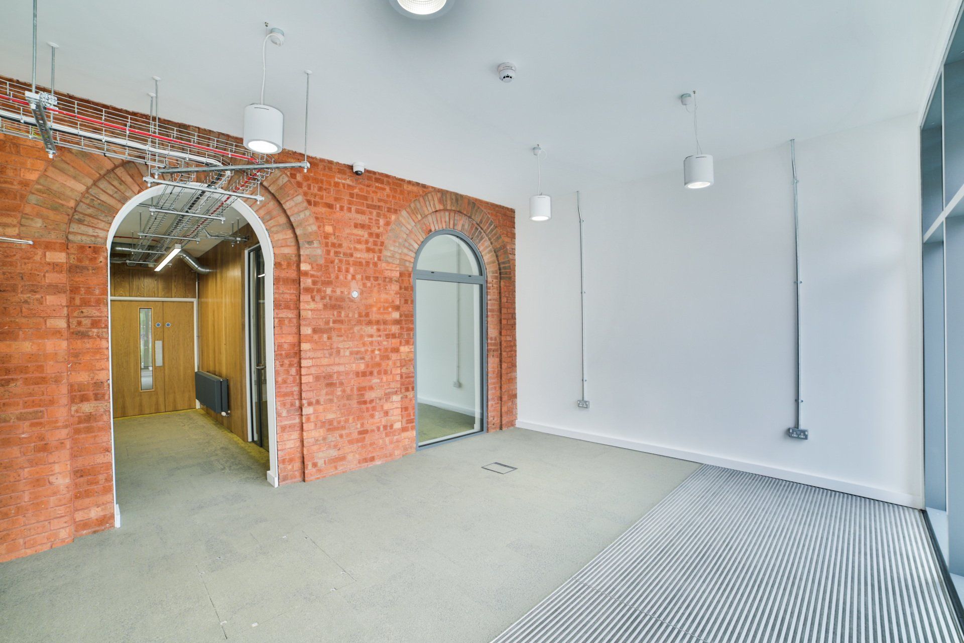 Rlam interior exposed brick wall Regeneration and refurbishment of Grade II listed building Bristol